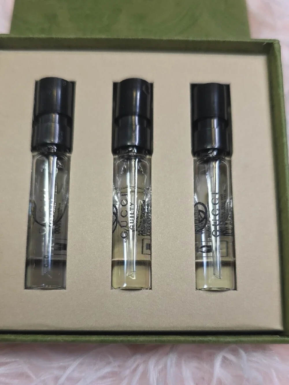 Gucci embossed olive green perfume box with subtle metallic logo